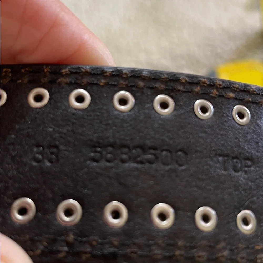 Engraved silver and studded, leather cowboy belt